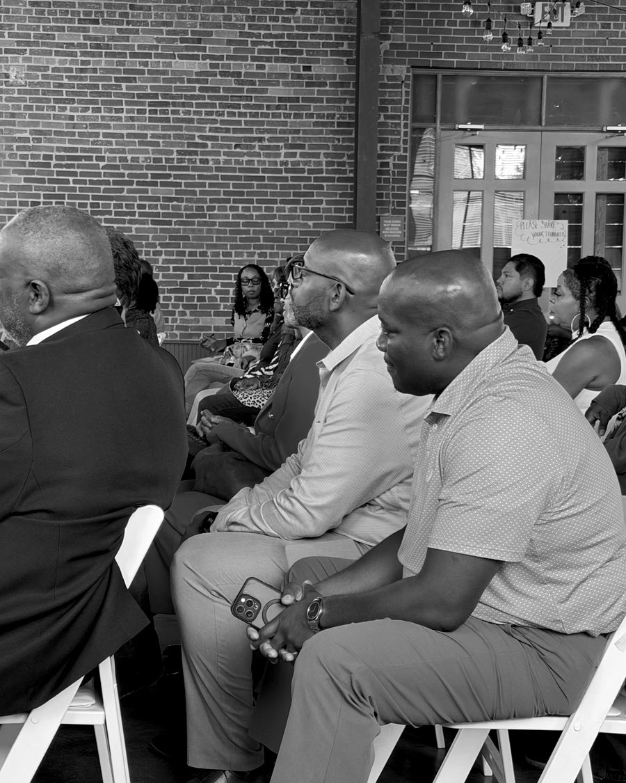 Pastors and leaders seated in rows, listening